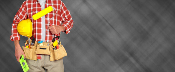 Builder handyman with paint roller.