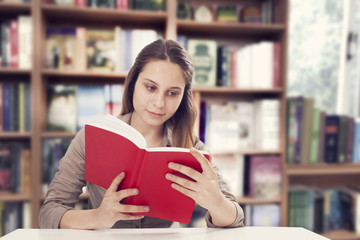 Young woman reading book