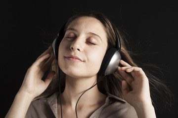 Young woman listening music