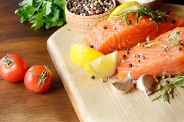 Raw salmon on cutting board