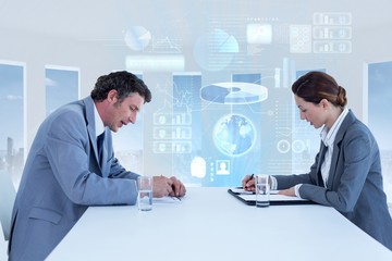 Composite image of business people working together 