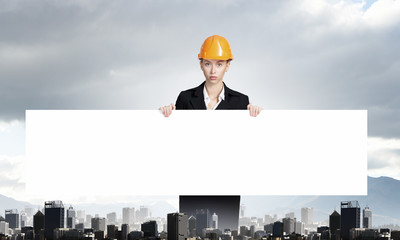 Builder woman with banner