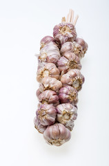 String of garlic isolated on white background © wjarek