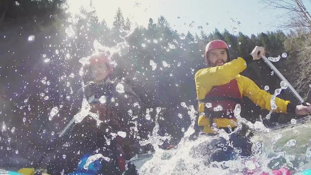 Rafting and rowing on river. Slow motion.