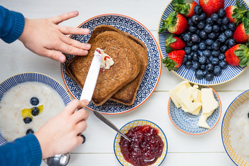 Tasty Family Breakfast with Toasts, Porridge, Berries © manuta