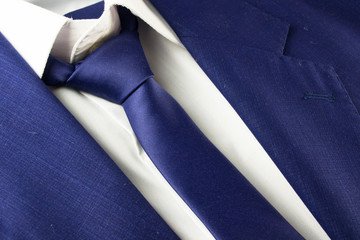 Detail view of business blue suit with tie