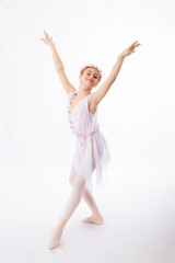 Ballerina  is dancing on a white background