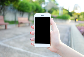 Holding smartphone with black screen.