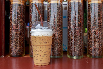 Obraz premium Ice coffee and coffee bean bottle.