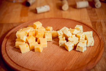 Cheese on a dark table.