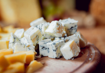 Cheese on a dark table.