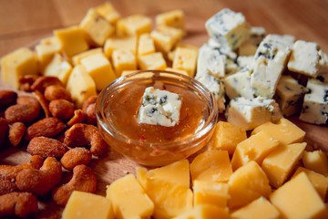 Cheese on a dark table.