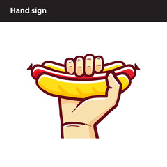 Hand holds a tasty hot dog