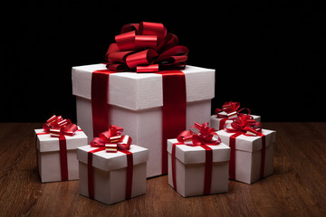 Obraz premium one large white gift box with small gift boxes