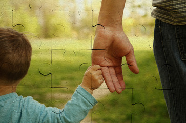  parent holds the hand of a small child