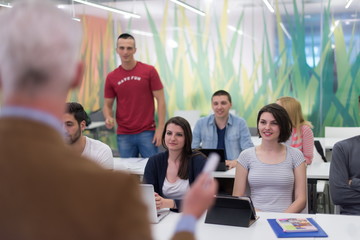 teacher with a group of students in classroom