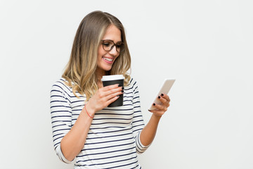 Cheerful woman looking at mobile phone