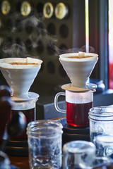 Steaming coffee at a cafe