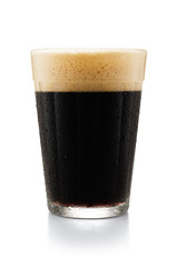 Glass of dark beer isolated on white background