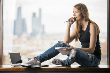 Woman on windowsill