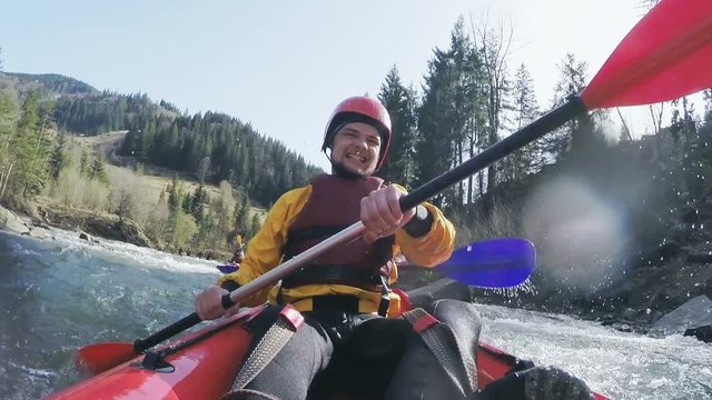 Whitewater kayaking. Slow motion.