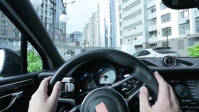 Driving car in the city first person view.