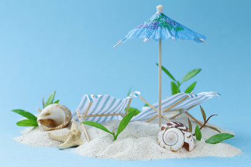 Travel vacation concept - sand island beach with sunbeds