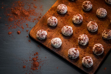 Small chocolate cakes on a cutting board