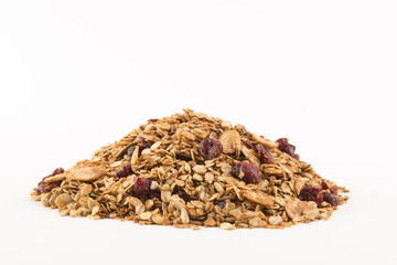 Pile of Granola cereal with raisins on white