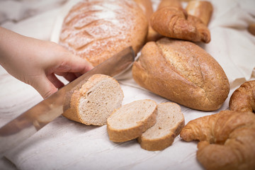 Fresh homemade bread in a cotton cloth background