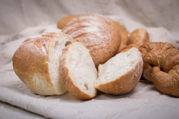 Fresh homemade bread in a cotton cloth background