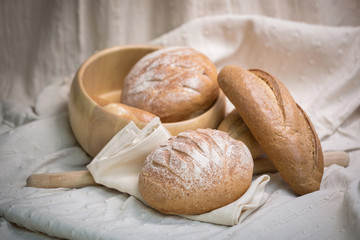 Fresh homemade bread in a cotton cloth background