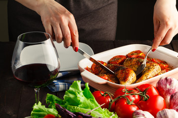 Woman hands slicing up tasty roasted grilled chicken