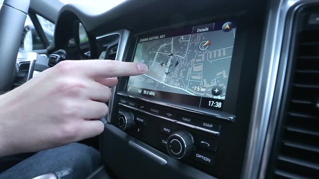 Man uses a navigator in the car.