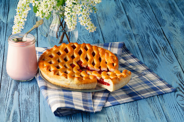 slice of cherry pie with a glass of milk