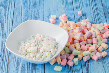 Candy sweet marshmallows in white dish