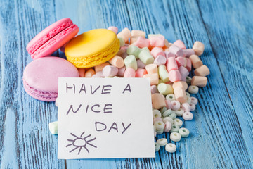 Party decoration. Sweets, marshmallow and note have a nice day