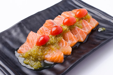 Slices of Salmon Served with Spicy Sauce