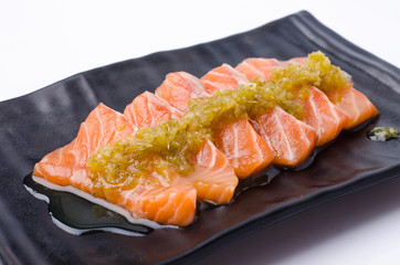 Slices of Salmon Served with Spicy Sauce
