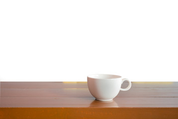 A cup on wooden table with isolate