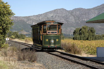 FRANSCHHOEK WESTERN CAPE SOUTH AFRICA. Tourist train at Ricketey Bridge wine estate in the...