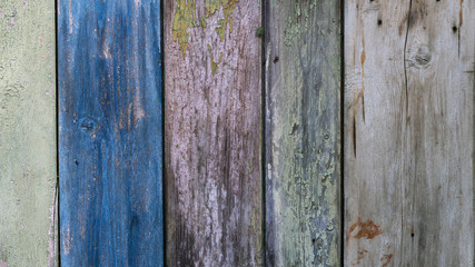 Boards farmhouse. Old boards, paint residues. Texture of wooden boards. Paint color - blue, green, gray, beige color
