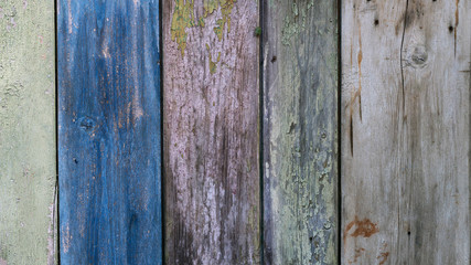 Boards farmhouse. Old boards, paint residues. Texture of wooden boards. Paint color - blue, green, gray, beige color
