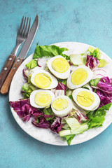 Egg salad with organic boiled eggs and green and red lettuce