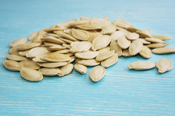 Pumpkin seeds on a blue background