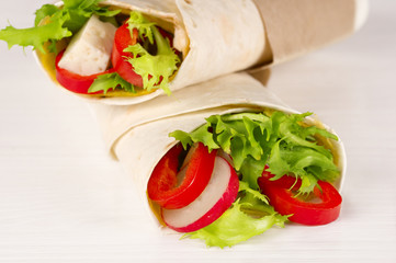 Vegan shawarma wrap, roll with vegetabes and cheese.