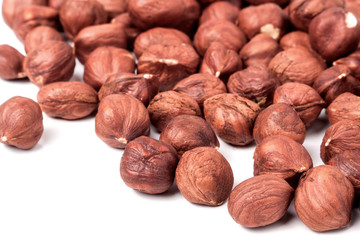 peeled hazelnuts isolated on white background macro