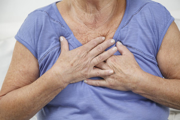Elderly woman with heart burn