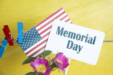 Obraz premium Raise the American flag in honor against the background of a flower! Memorial Day. selective focus sunlight Effect filter