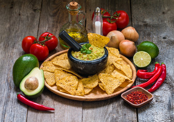 Bowl of delicious homemade Guacamole with nachos